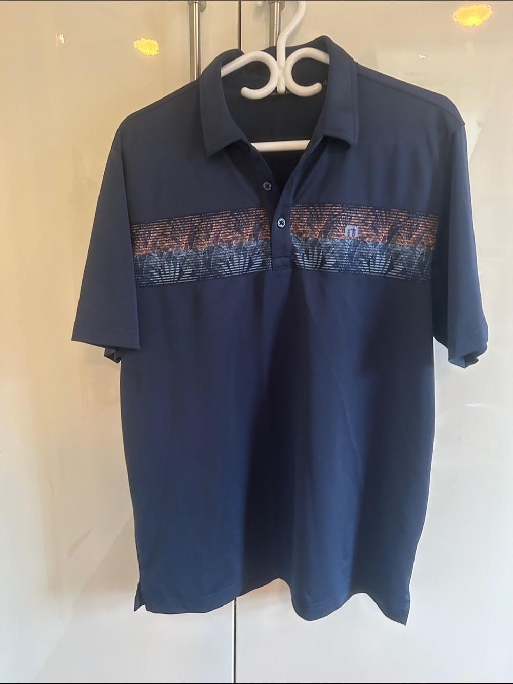 Men's Travis Mathew Navy Golf Shirt with Chest Stripe